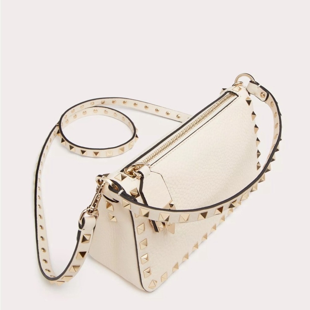 Small Valentino Garavani Rockstud crossbody bag in grainy calfskin leather.